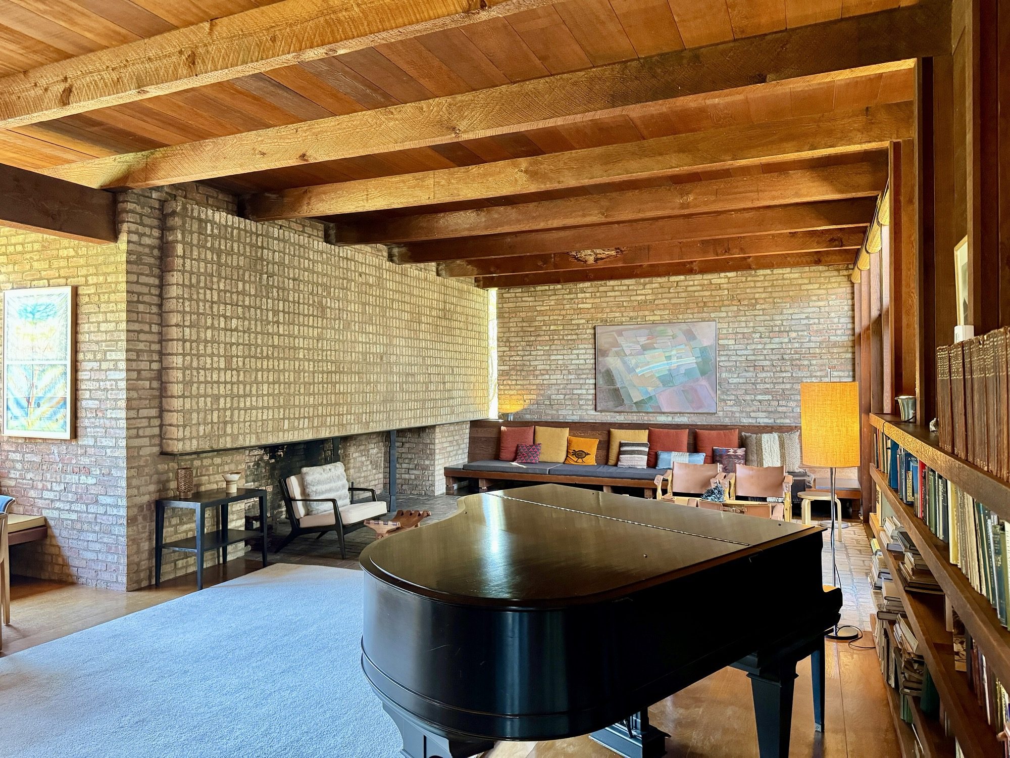 A designed living interior — the interior designer plans space, light, finishes and furniture together, not just the surface.