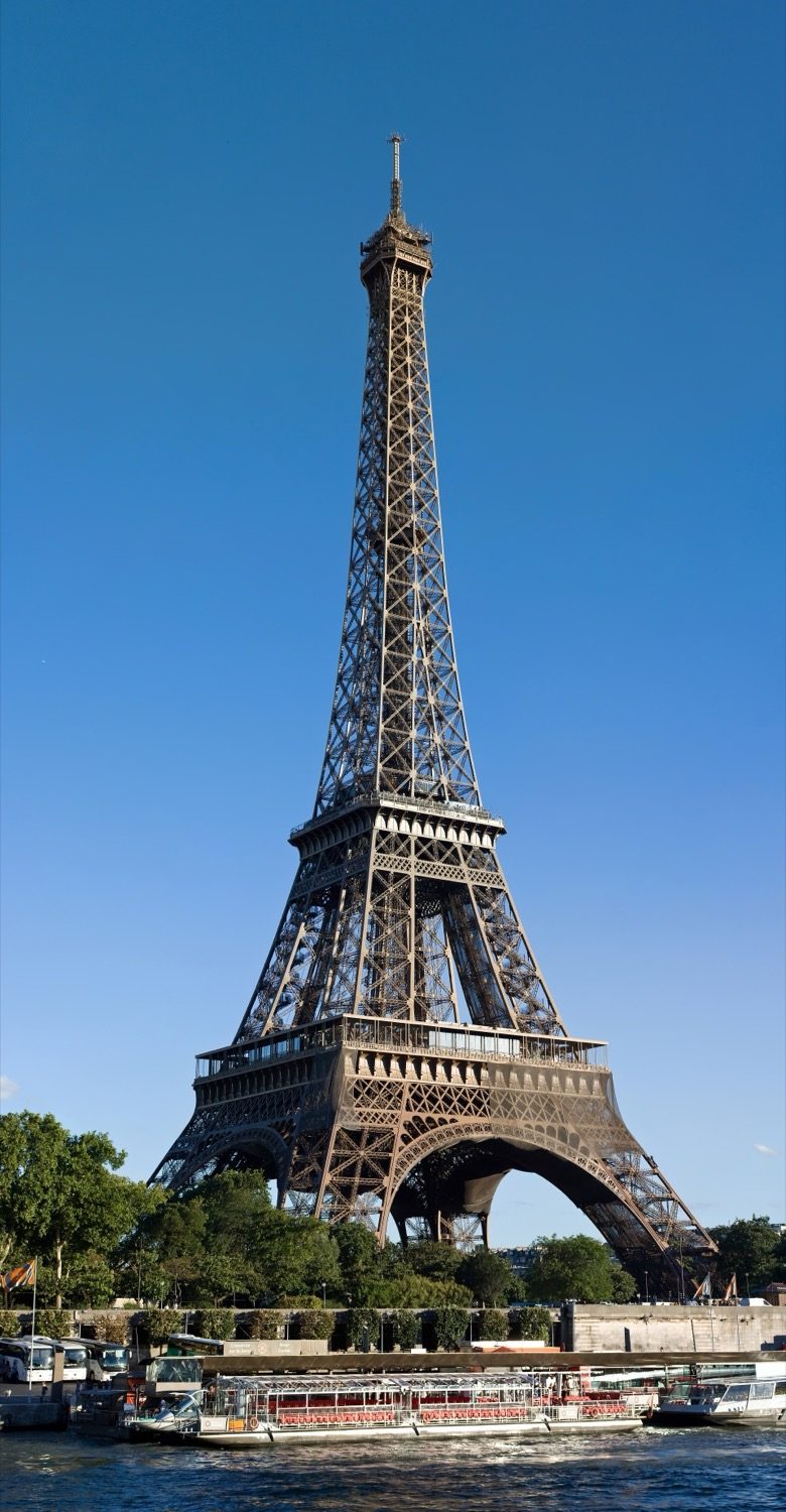 The wrought-iron lattice of the Eiffel Tower — a structure shaped by its wind-moment diagram.