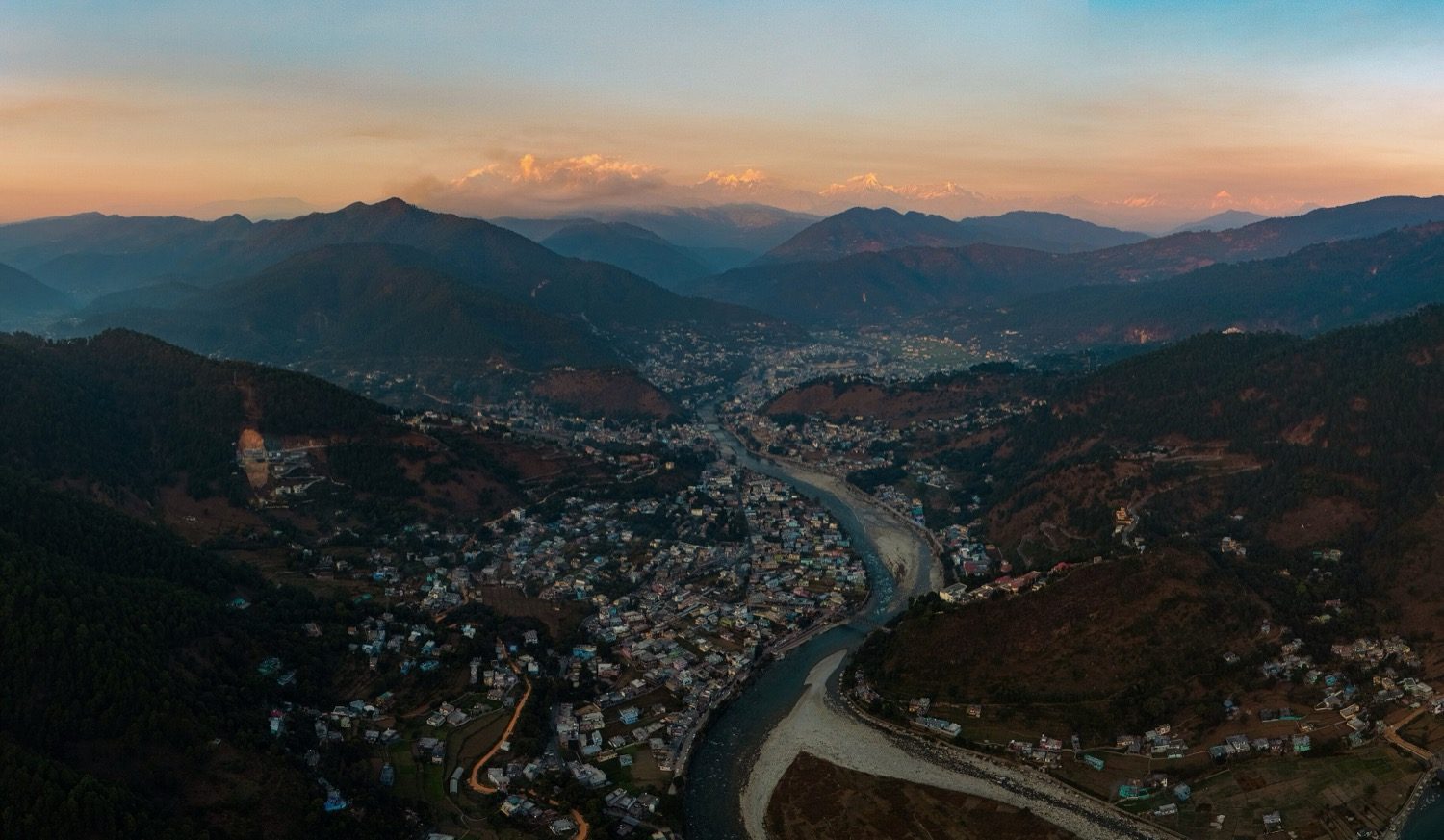 An aerial view of an urban area showing plots, roads and access — the man-made site layer.