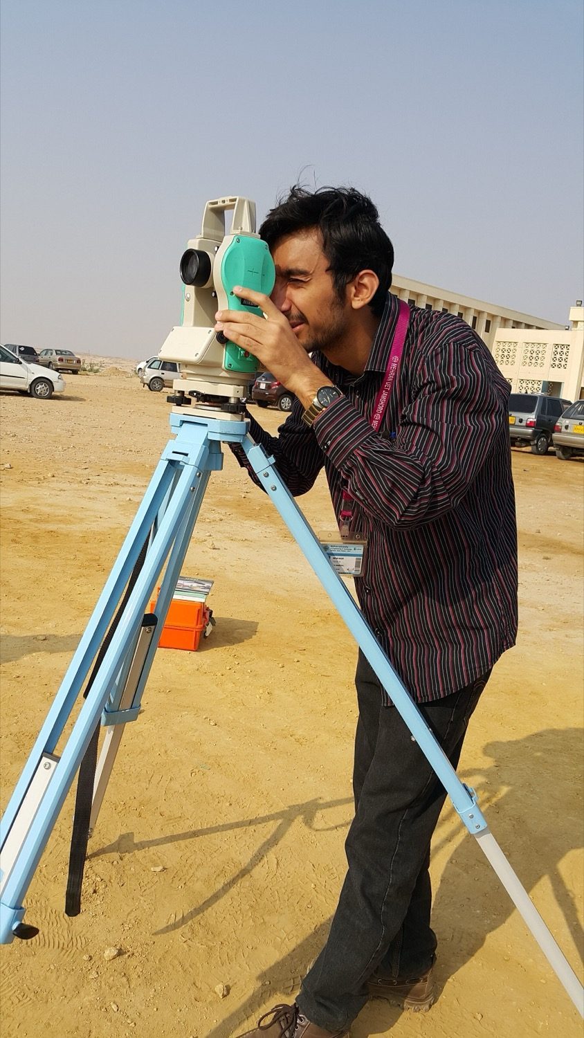 A close view of a theodolite's graduated circles and telescope.
